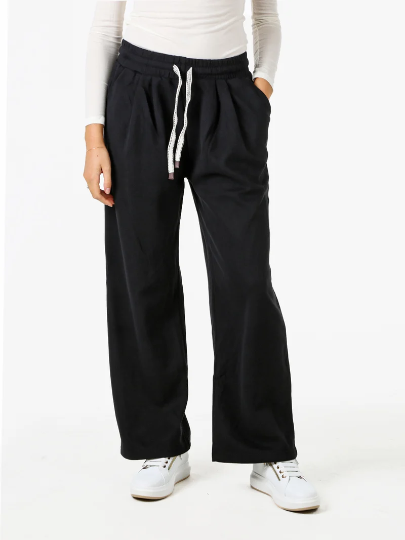 Pantaloni donna in felpa a gamba larga con coulisse - nero