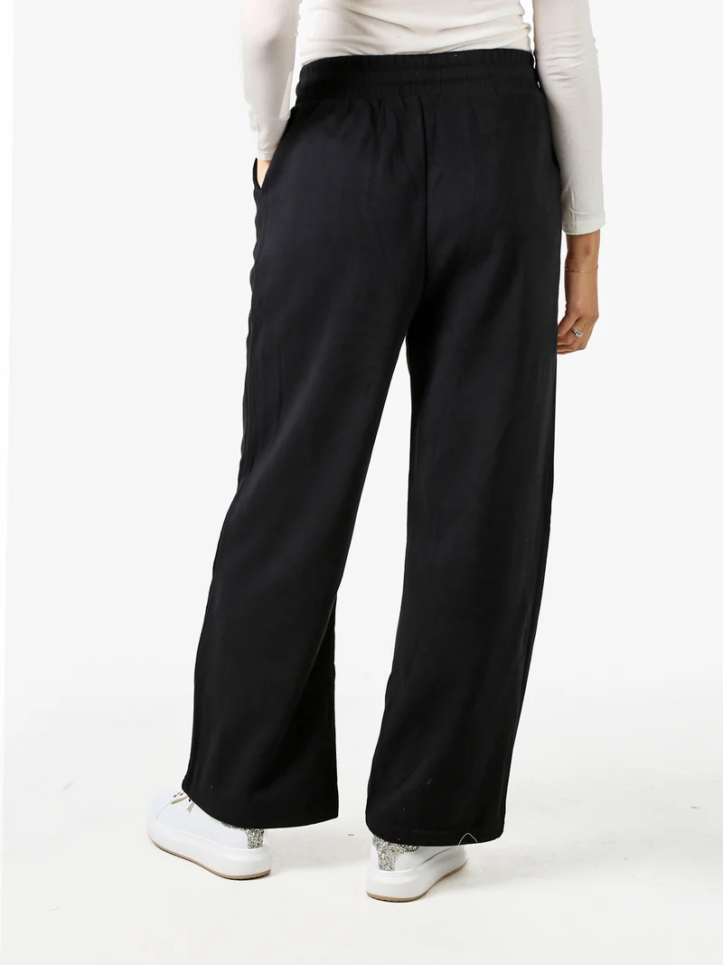 Pantaloni donna in felpa a gamba larga con coulisse - nero