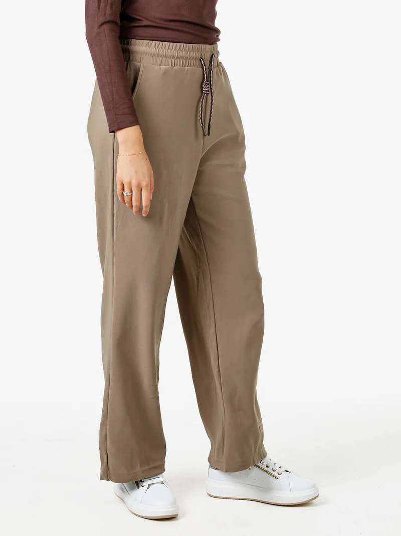 Pantaloni donna elasticizzati in tessuto tecnico con coulisse - taupe