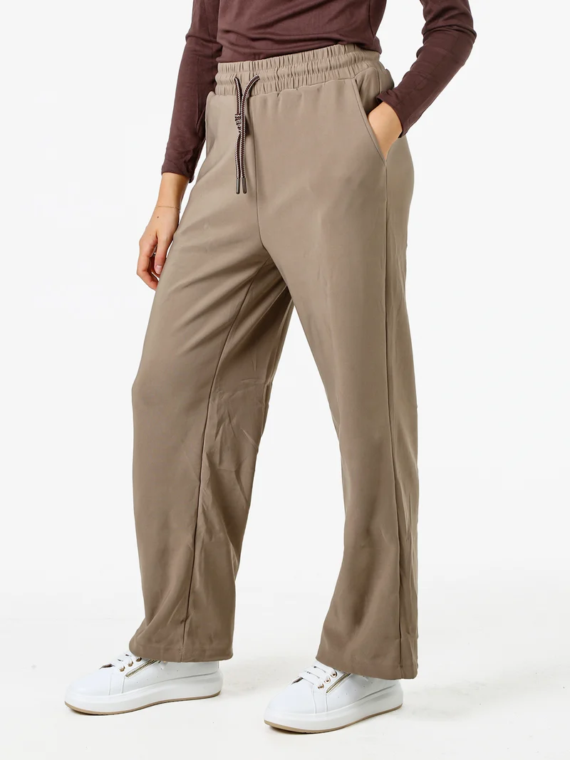Pantaloni donna elasticizzati in tessuto tecnico con coulisse - taupe