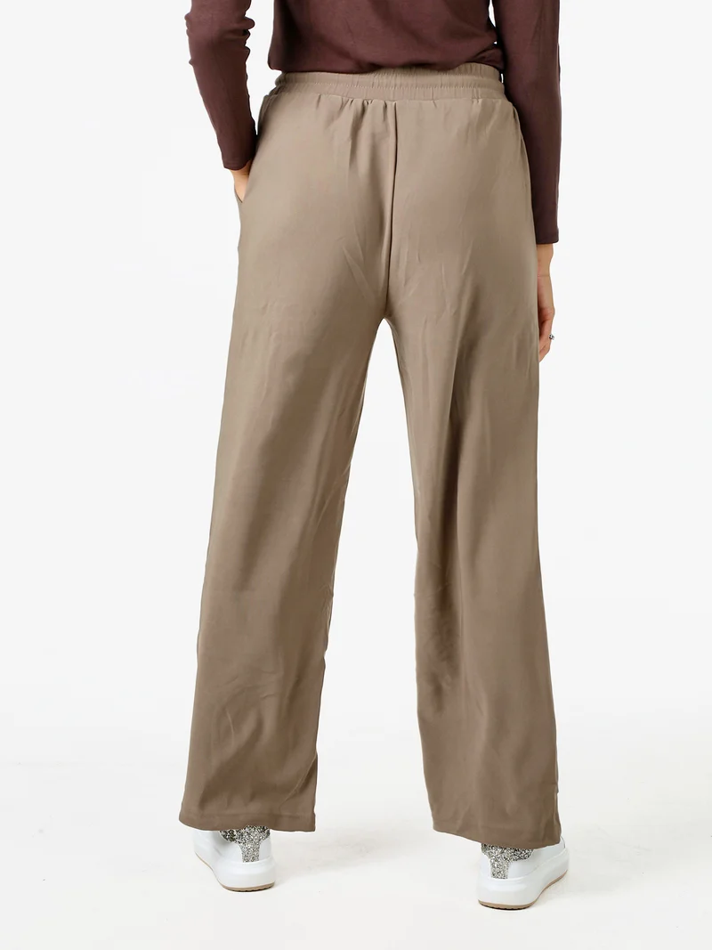Pantaloni donna elasticizzati in tessuto tecnico con coulisse - taupe