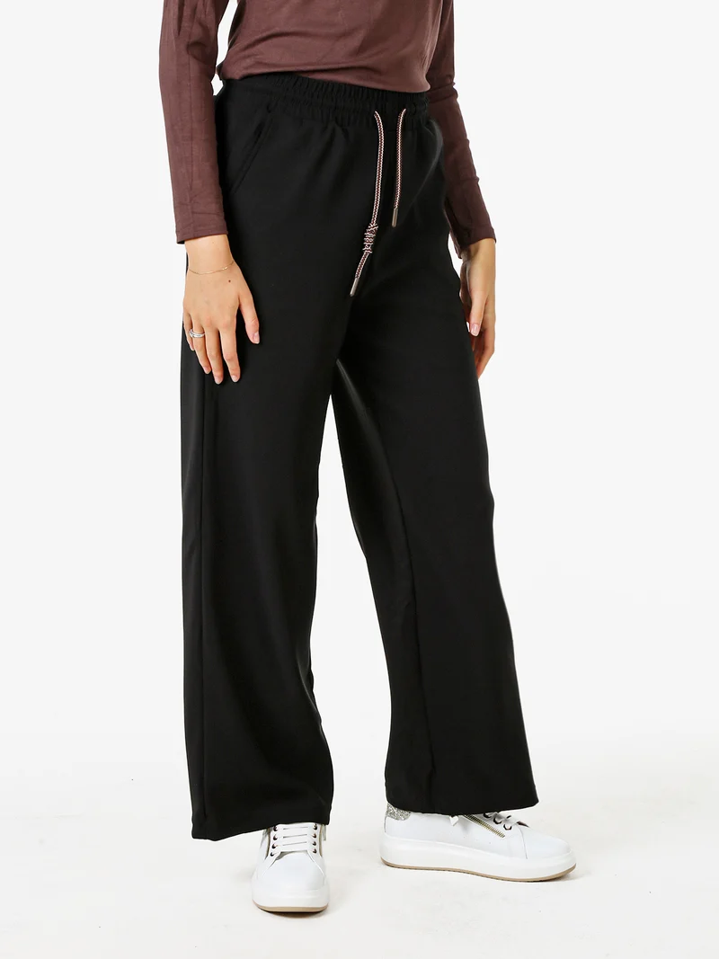 Pantaloni donna elasticizzati in tessuto tecnico con coulisse - nero