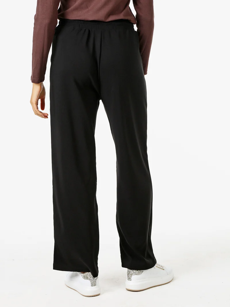 Pantaloni donna elasticizzati in tessuto tecnico con coulisse - nero