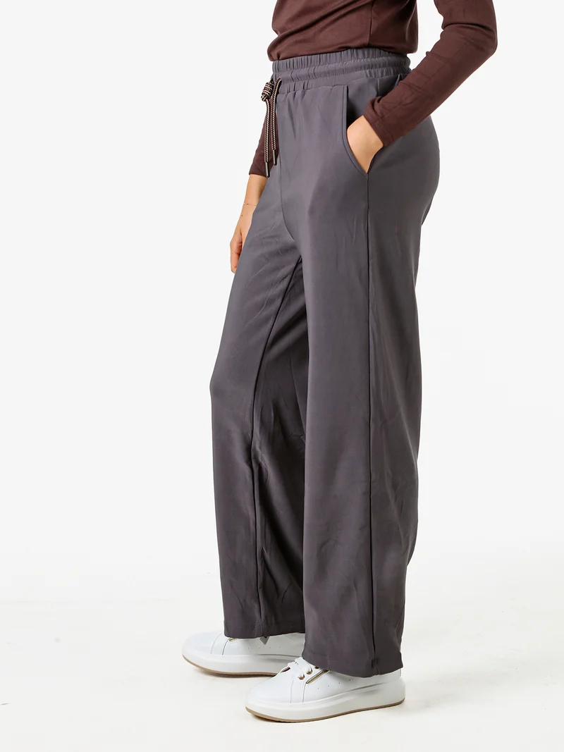 Pantaloni donna elasticizzati in tessuto tecnico con coulisse - grigio