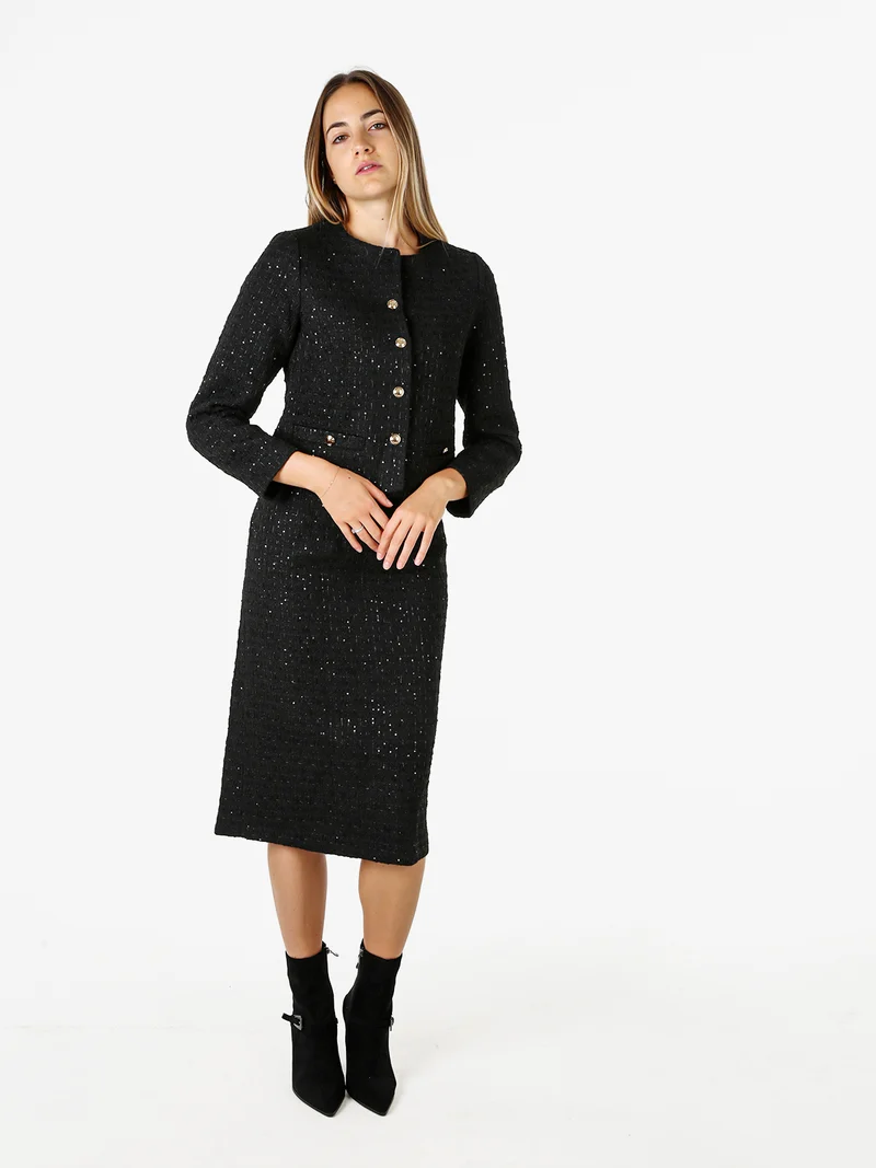 Completo elegante da donna con dettagli di paillettes e gonna- nero