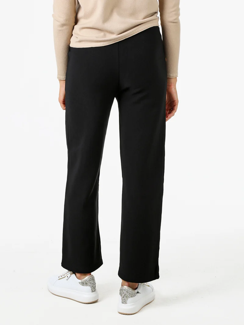 Pantaloni donna a vita alta con interno felpato e bottoni decorativi dorati - nero