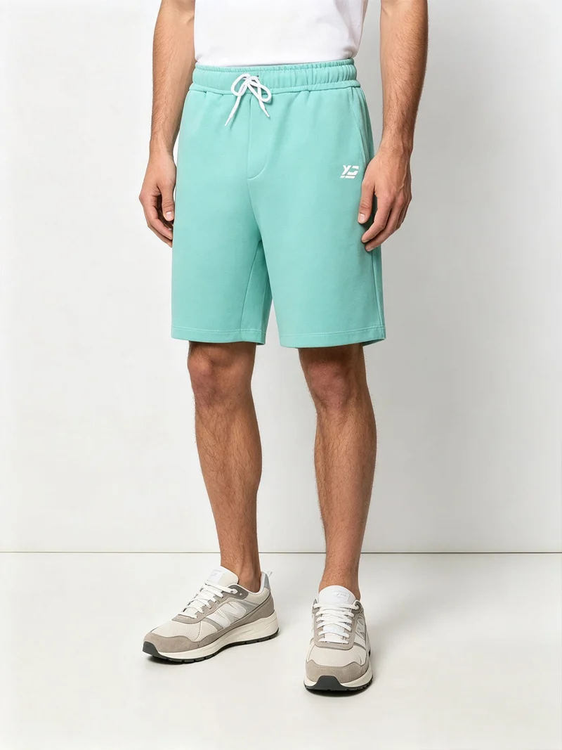 Bermuda da uomo in felpa con coulisse - verde chiaro