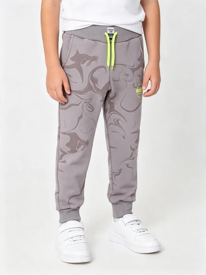 Pantaloni tuta da ragazzo in felpa con coulisse e polsini - fango