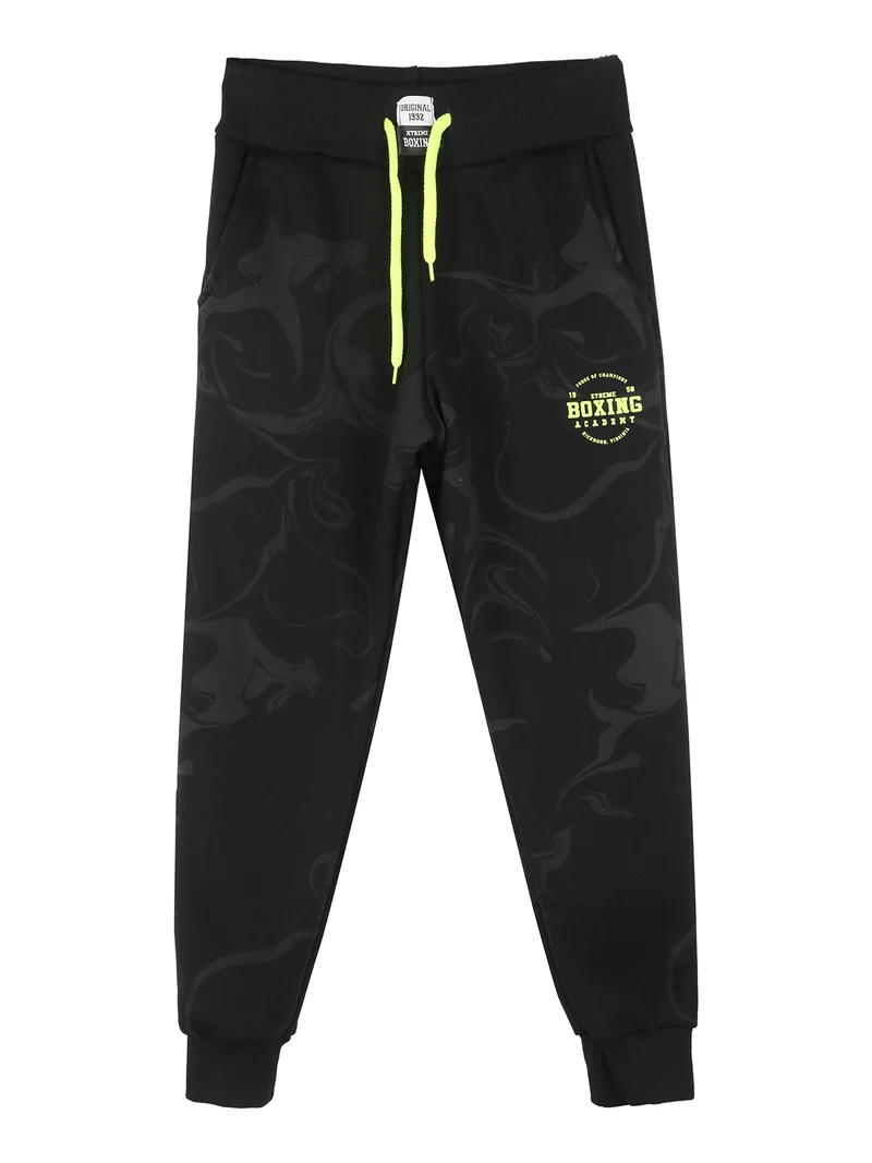 Pantaloni tuta da ragazzo in felpa con coulisse e polsini - nero