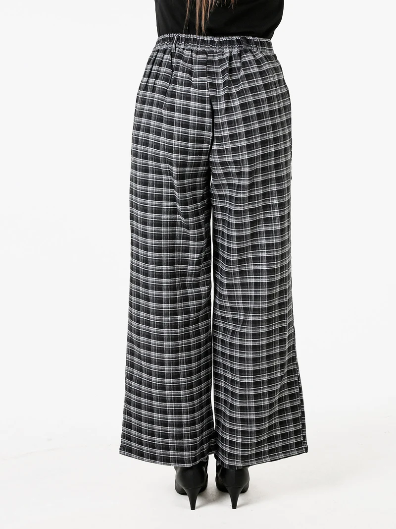 Pantaloni donna a gamba larga con stampa a quadri - nero