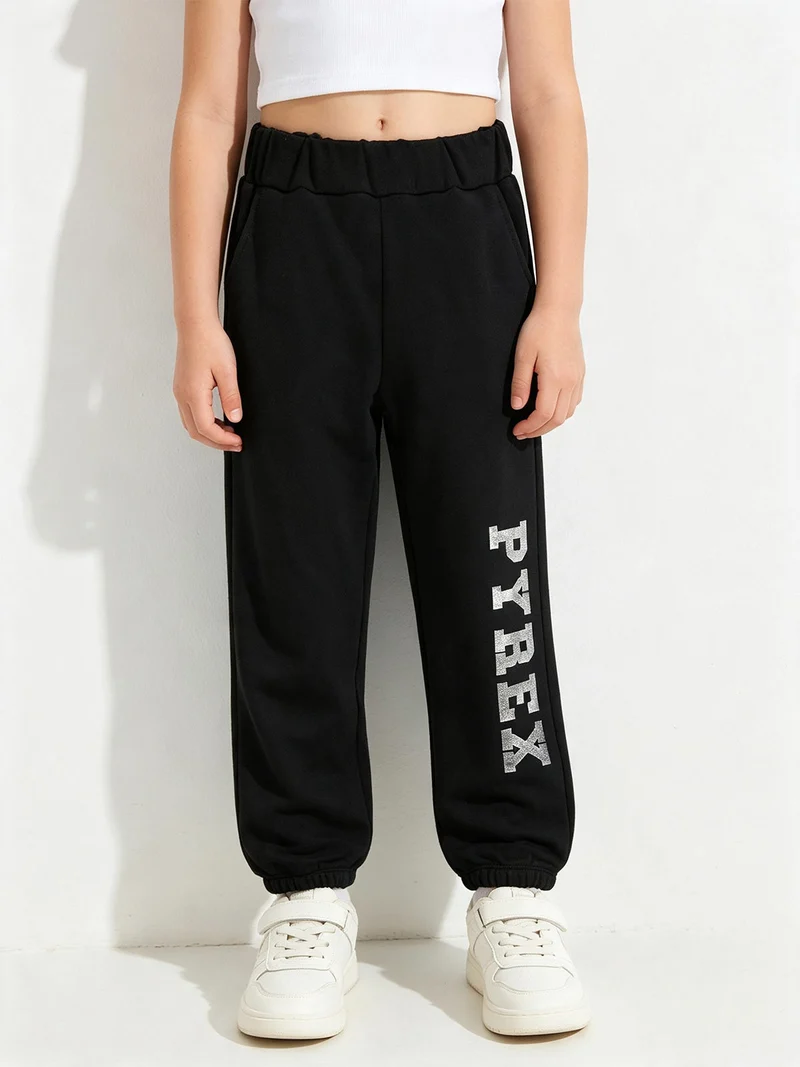 Pantaloni sportivi da ragazza con elastico alla caviglia - nero