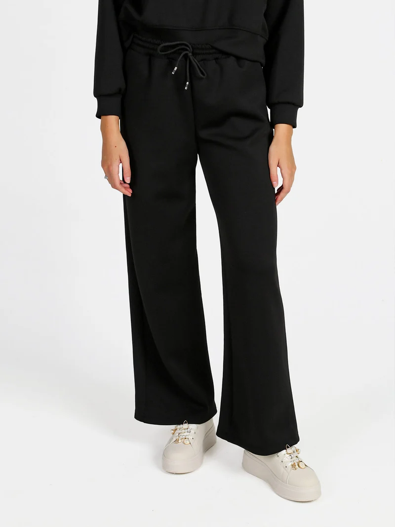 Pantaloni donna in felpa a gamba larga con coulisse - nero