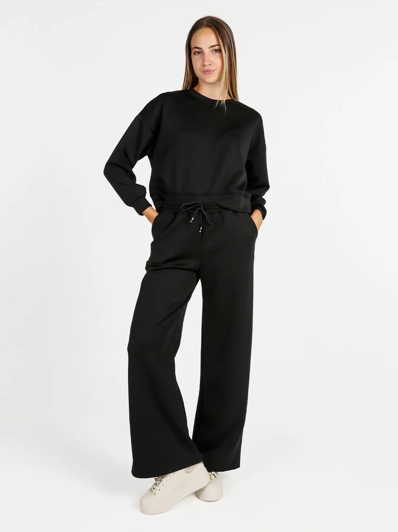 Pantaloni donna in felpa a gamba larga con coulisse - nero