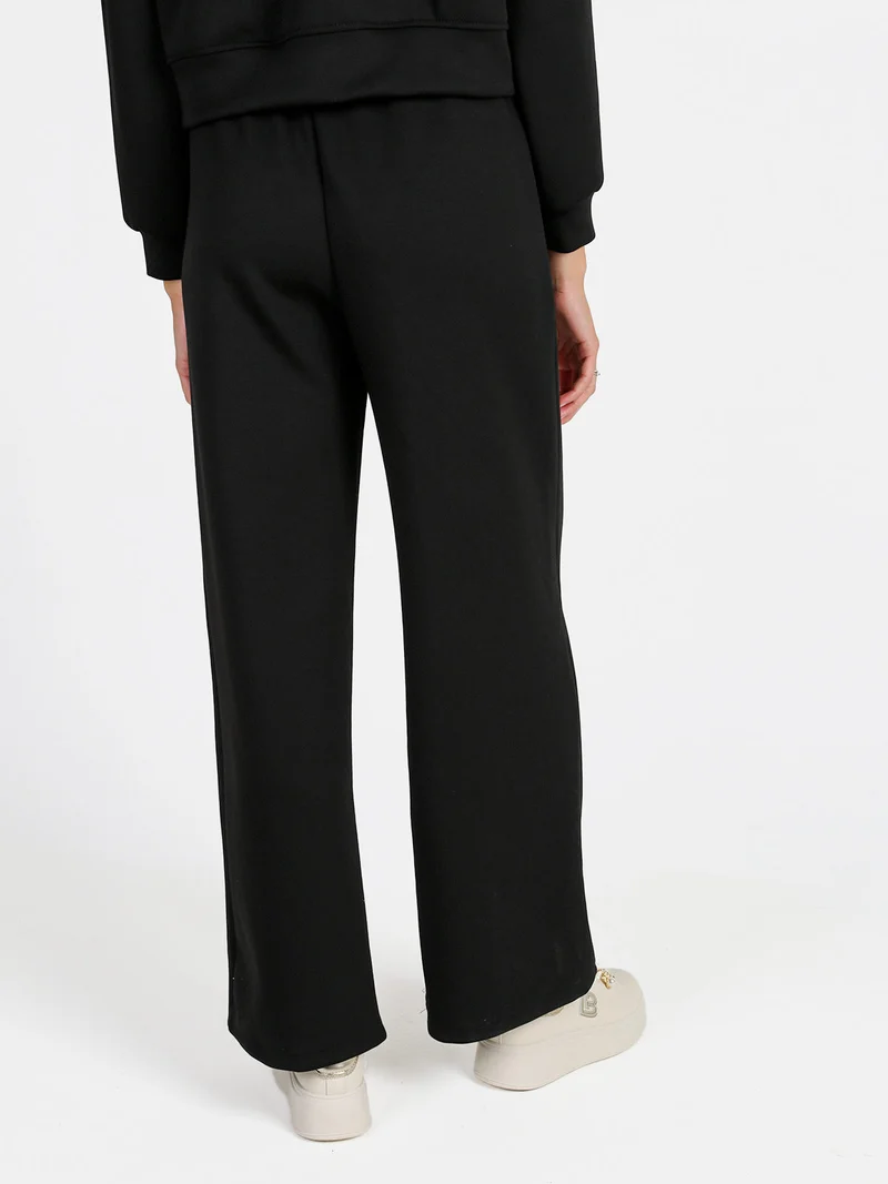 Pantaloni donna in felpa a gamba larga con coulisse - nero
