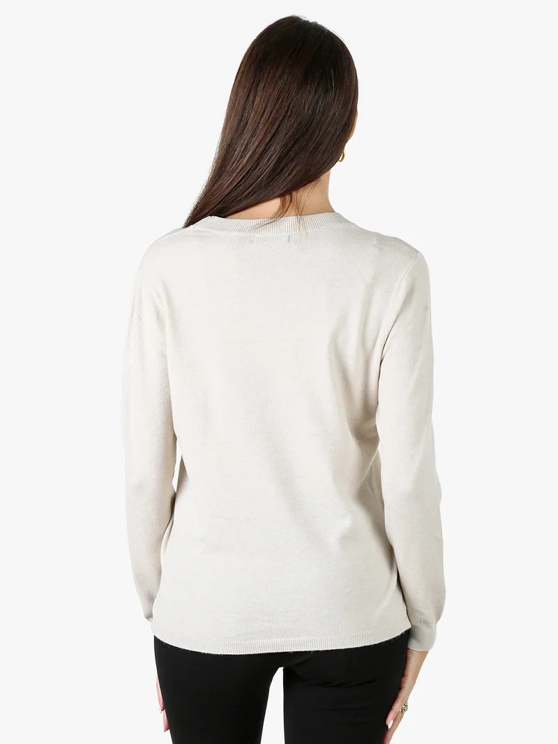Maglia girocollo da donna con ricamo sul finale - beige