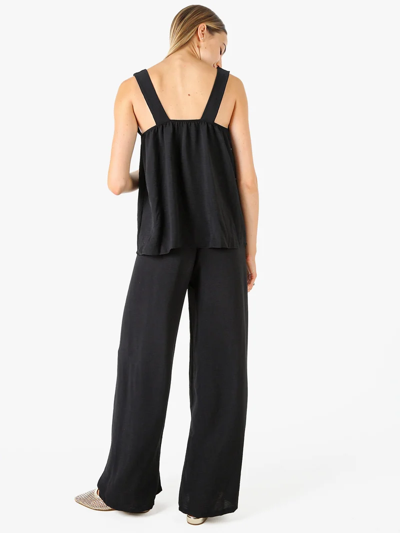 Completo casual da donna con top e pantaloni a gamba larga - nero