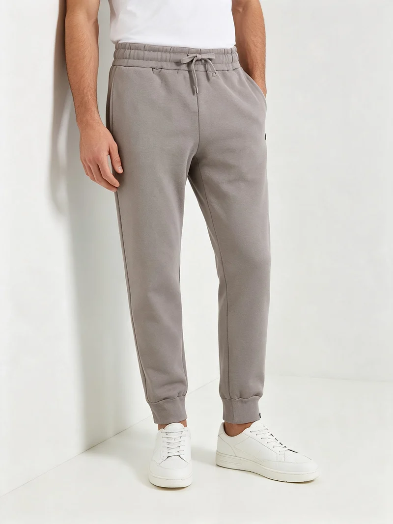 Pantaloni tuta da uomo con coulisse e polsini e interno felpato - fango