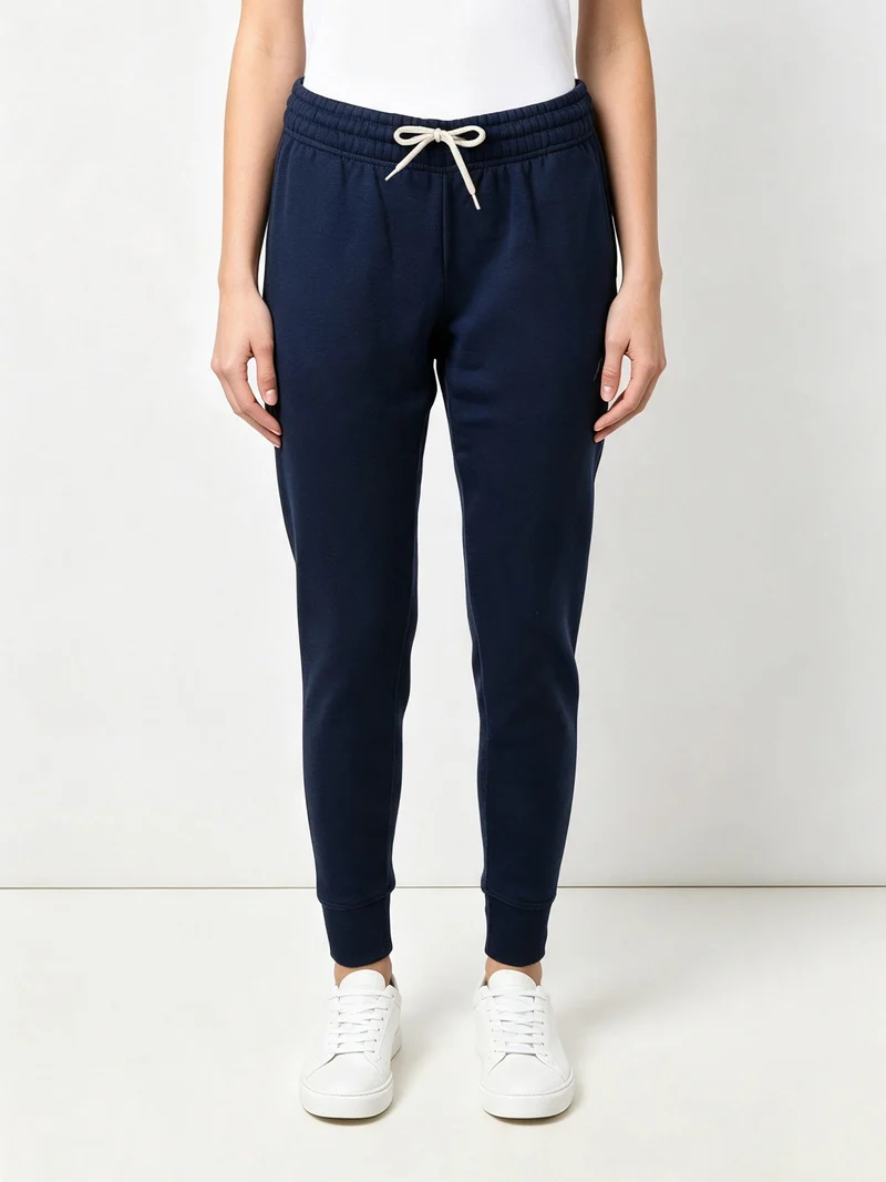 Pantaloni sportivi da donna con interno felpato e polsini - blu scuro