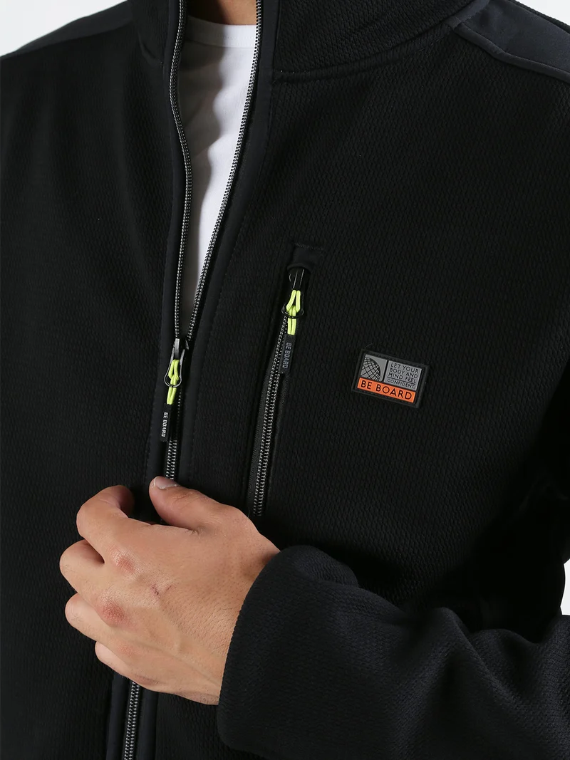 Giacca sportiva da uomo a collo alto con zip - nero