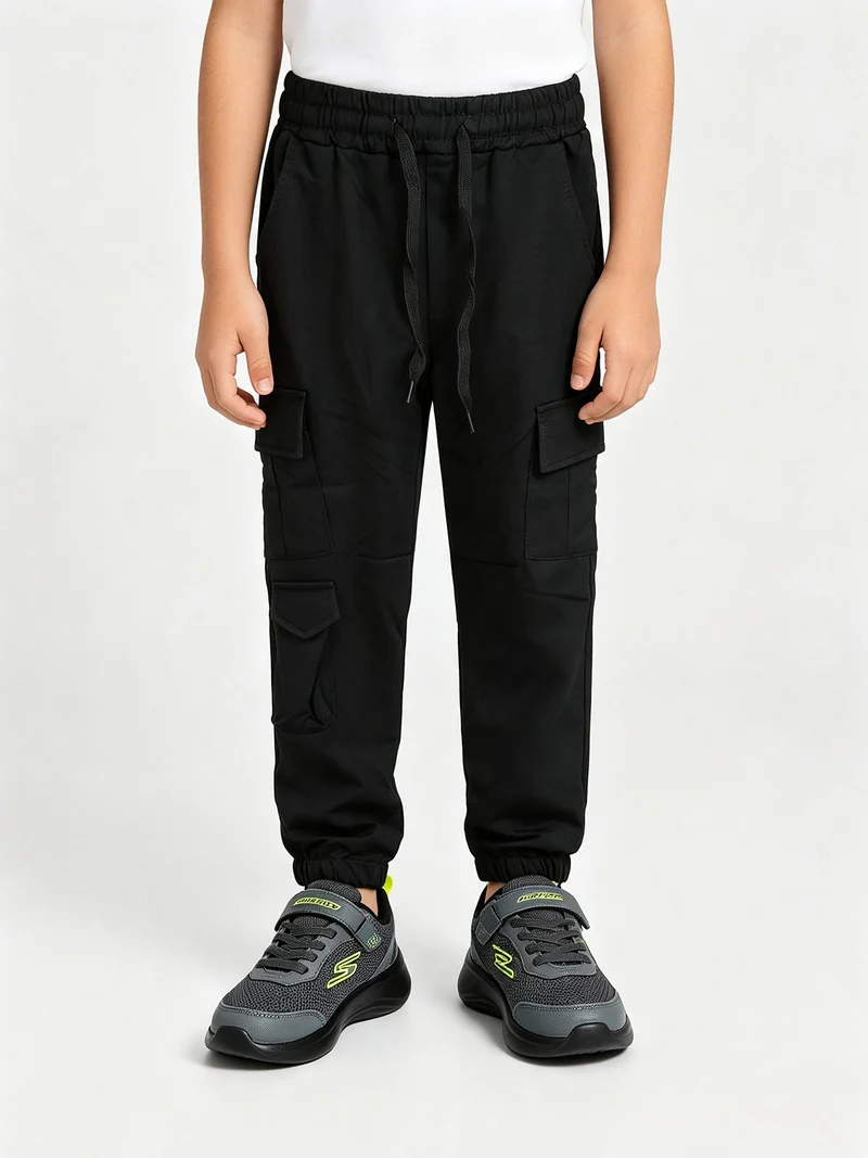 Pantaloni tuta da bambino con tasconi laterali e interno spazzolato - nero