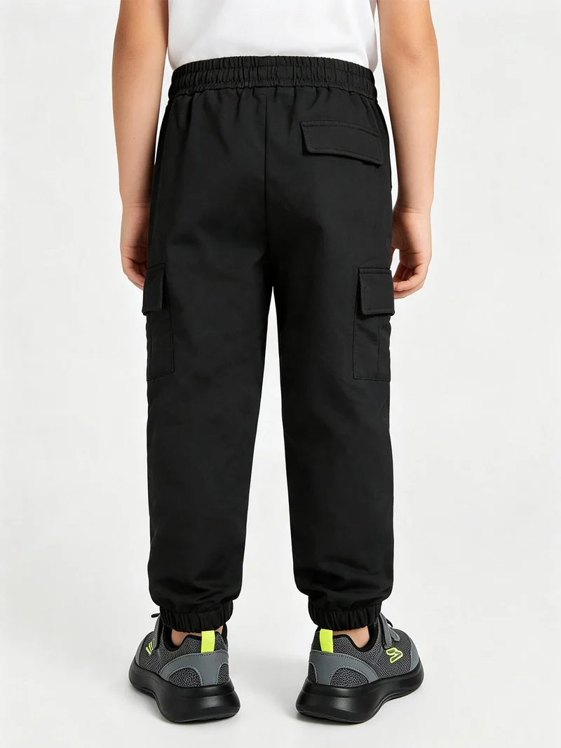 Pantaloni tuta da bambino con tasconi laterali e interno spazzolato - nero