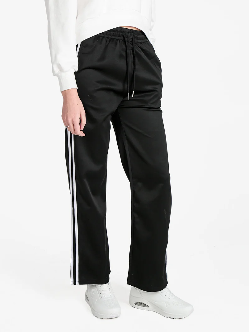 Pantaloni tuta da donna con strisce laterali - nero