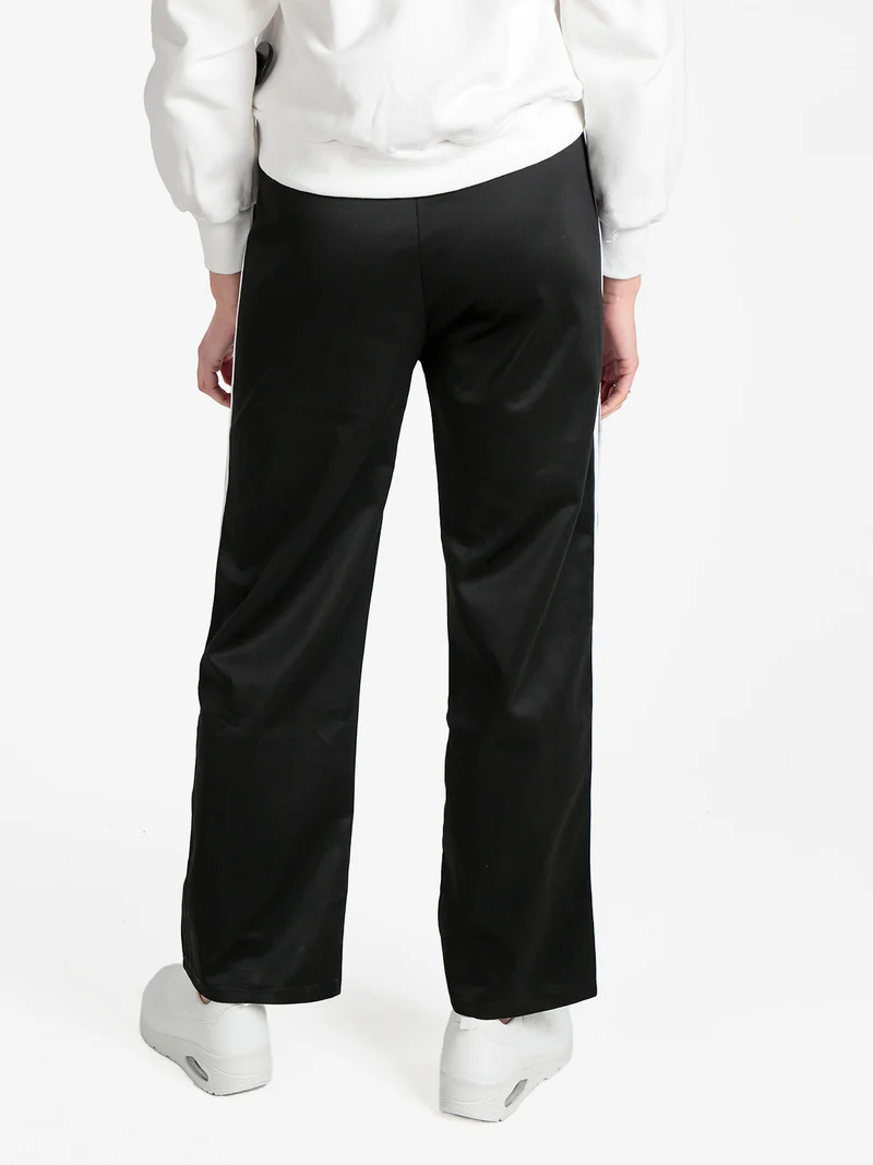 Pantaloni tuta da donna con strisce laterali - nero
