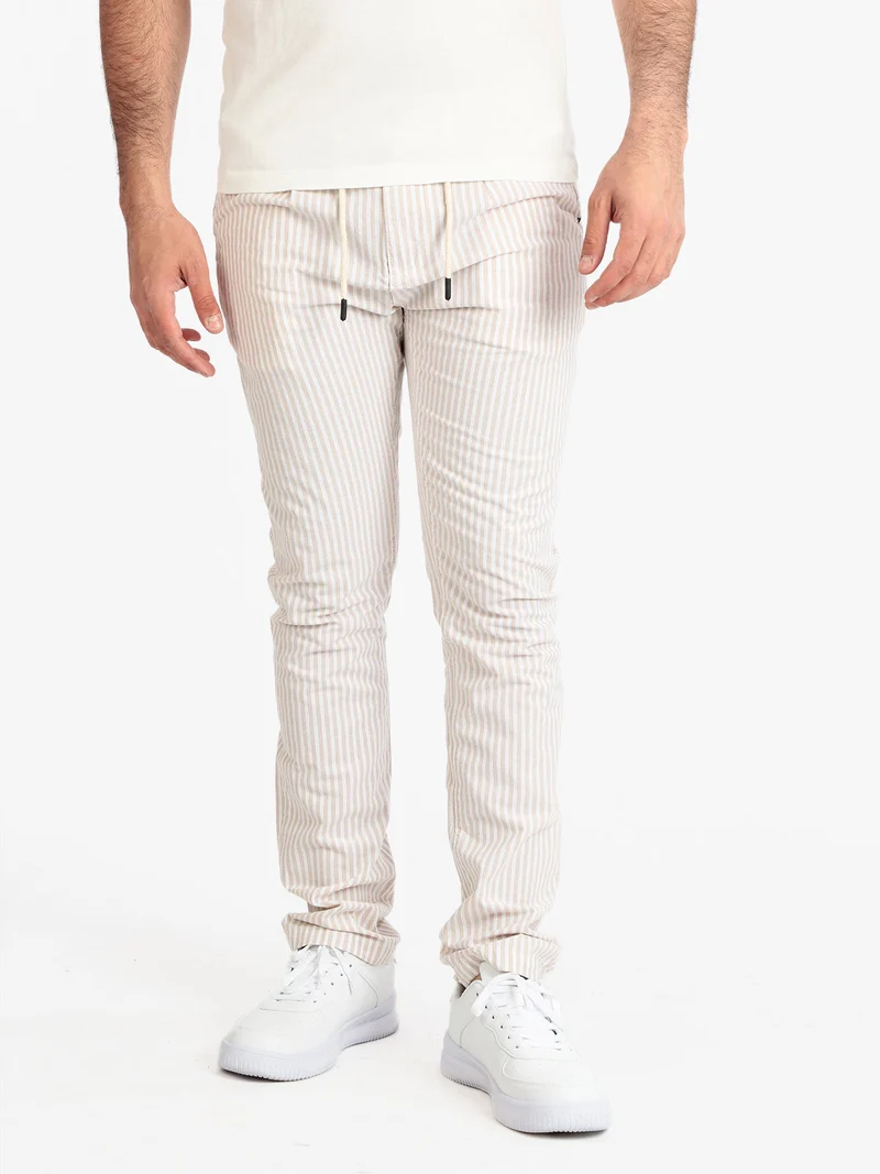 Pantaloni rigati in cotone con coulisse da uomo - beige