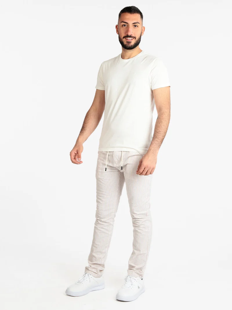 Pantaloni rigati in cotone con coulisse da uomo - beige