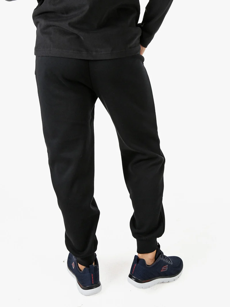 Pantaloni tuta da uomo felpati con polsini - nero