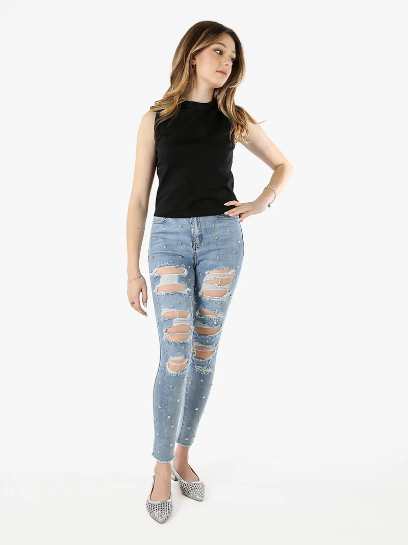 Jeans donna skinny con borchie e strappi - jeans