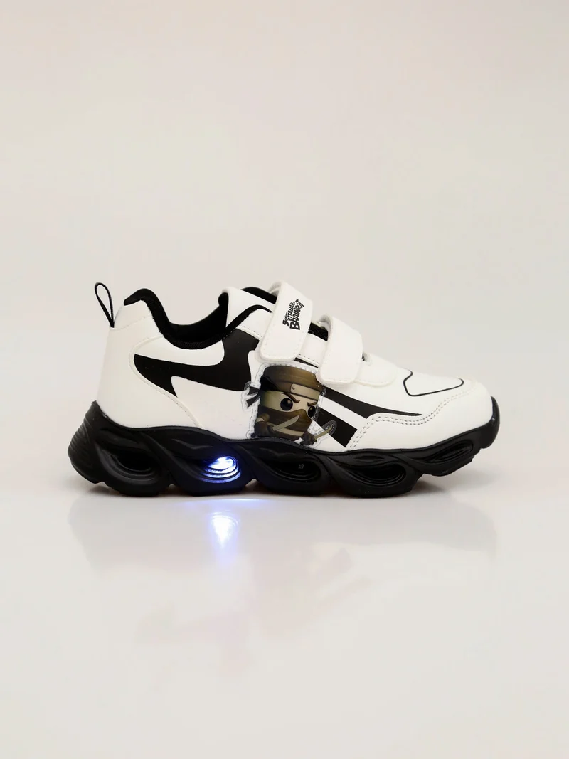 Sneakers da ragazzo con luci e cinturini a strappo - bianco