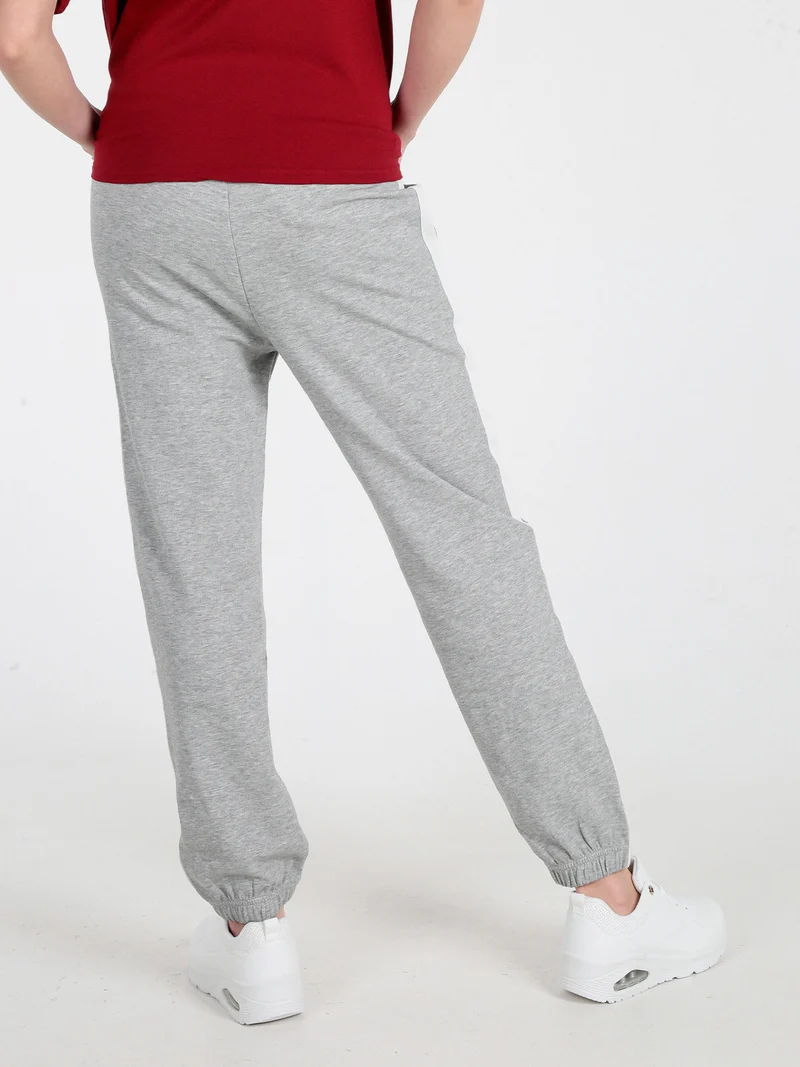 Pantaloni tuta da donna con coulisse e polsini - grigio