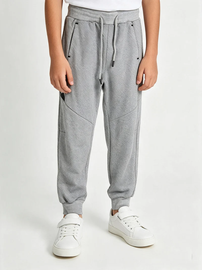 Pantaloni da ragazzo con coulisse e polsini - grigio
