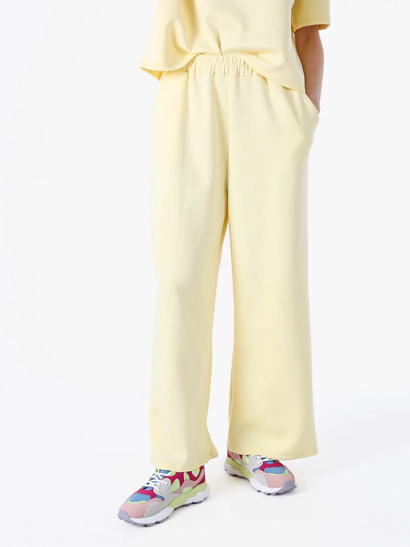 Pantaloni donna in felpa a gamba larga - giallo