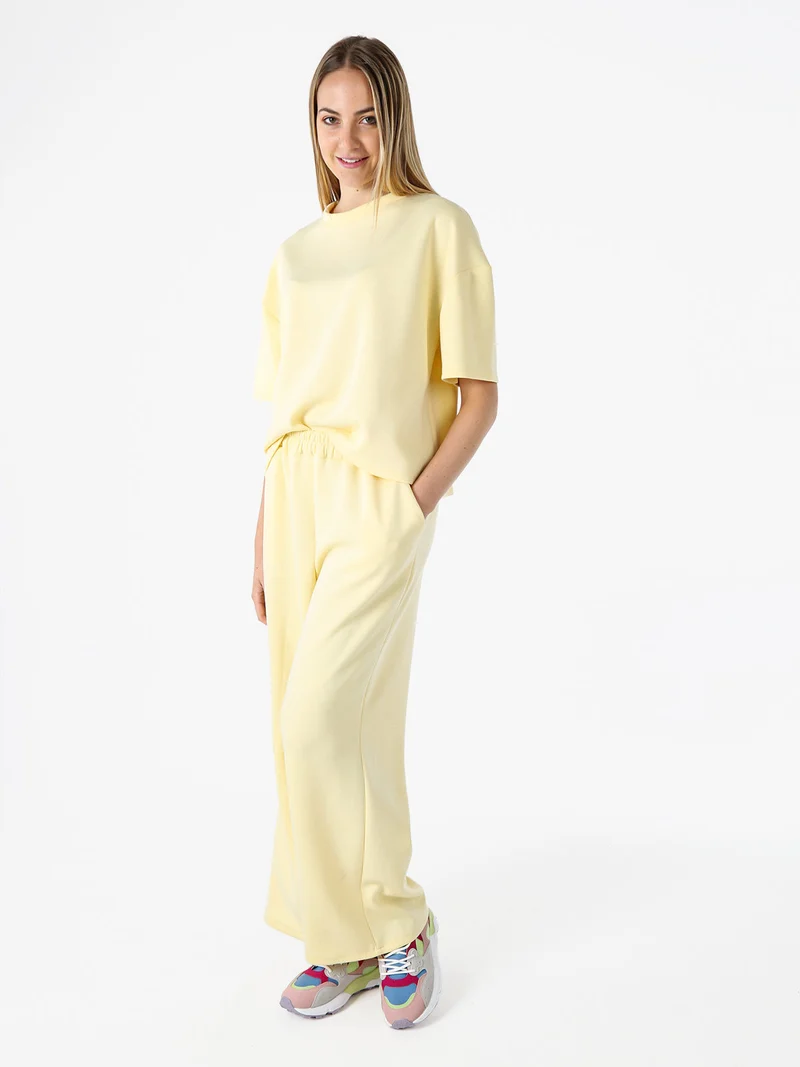 Pantaloni donna in felpa a gamba larga - giallo