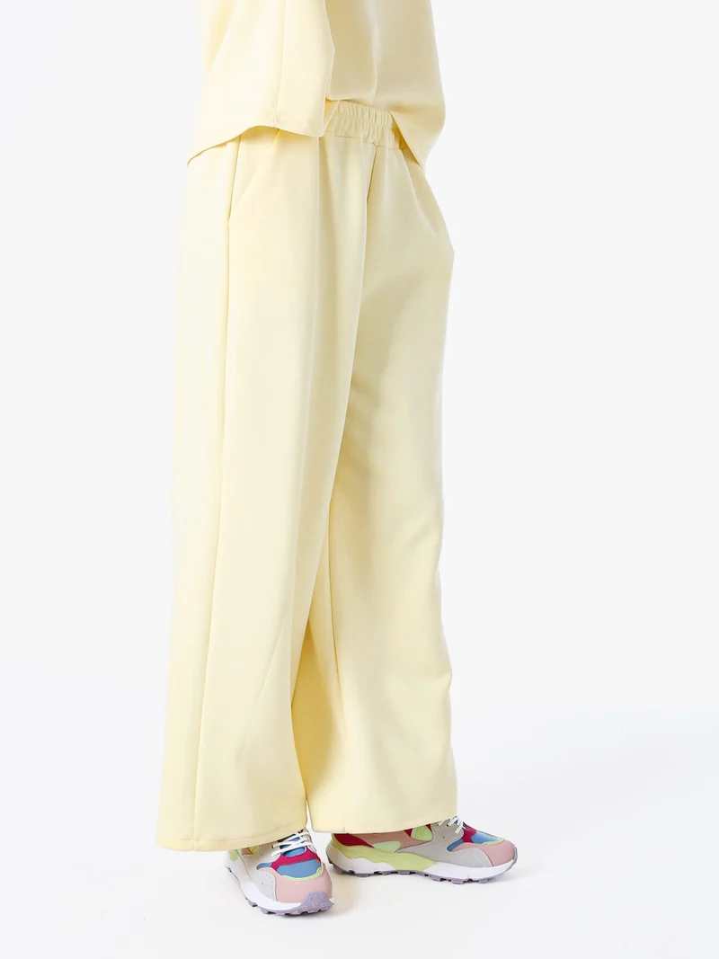 Pantaloni donna in felpa a gamba larga - giallo