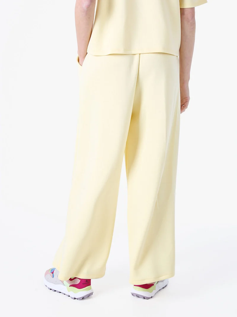 Pantaloni donna in felpa a gamba larga - giallo