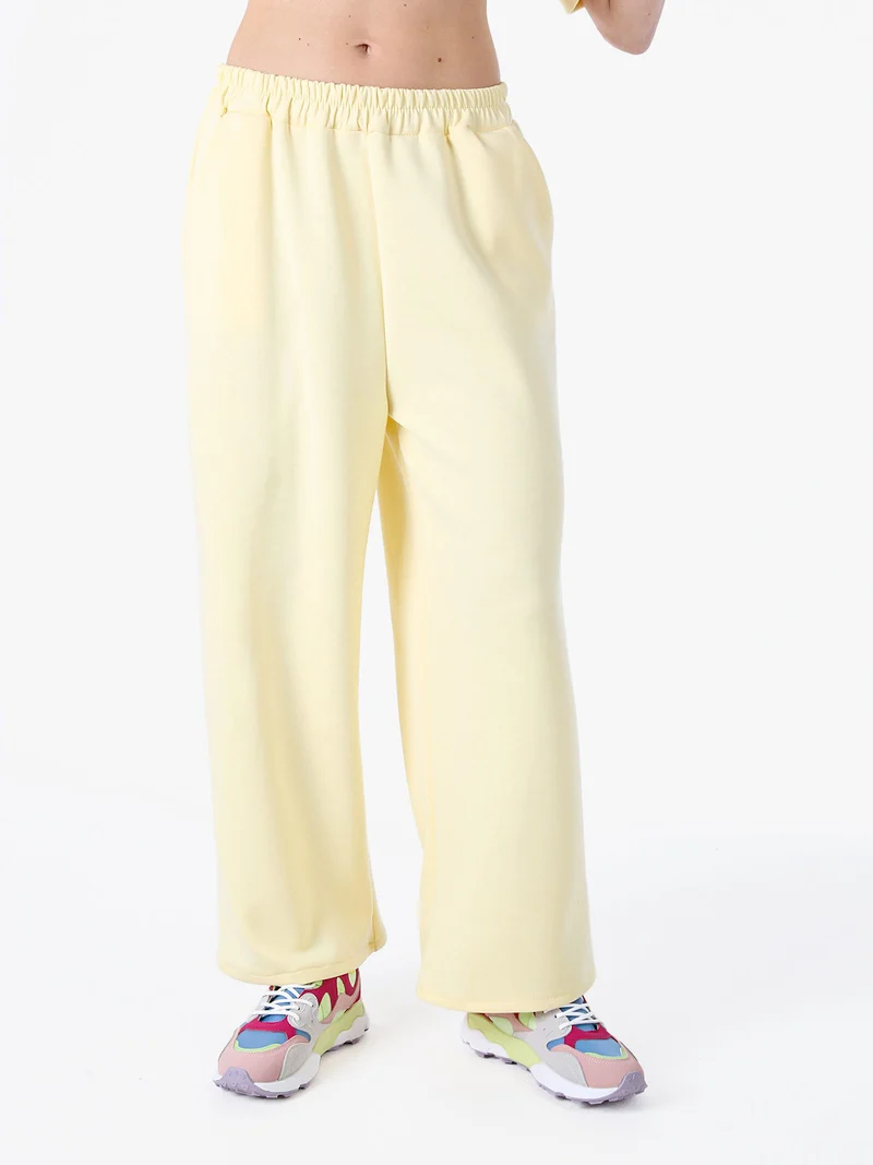 Pantaloni donna in felpa a gamba larga - giallo