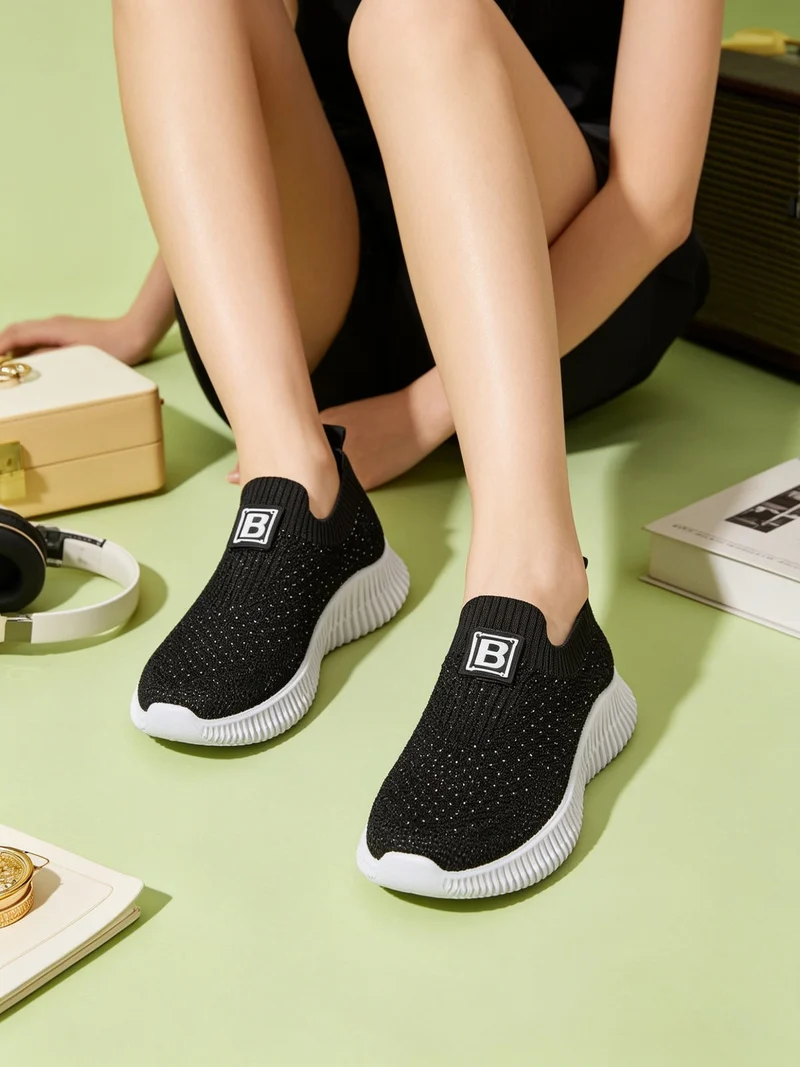 Sneakers donna slip on con borchie - nero