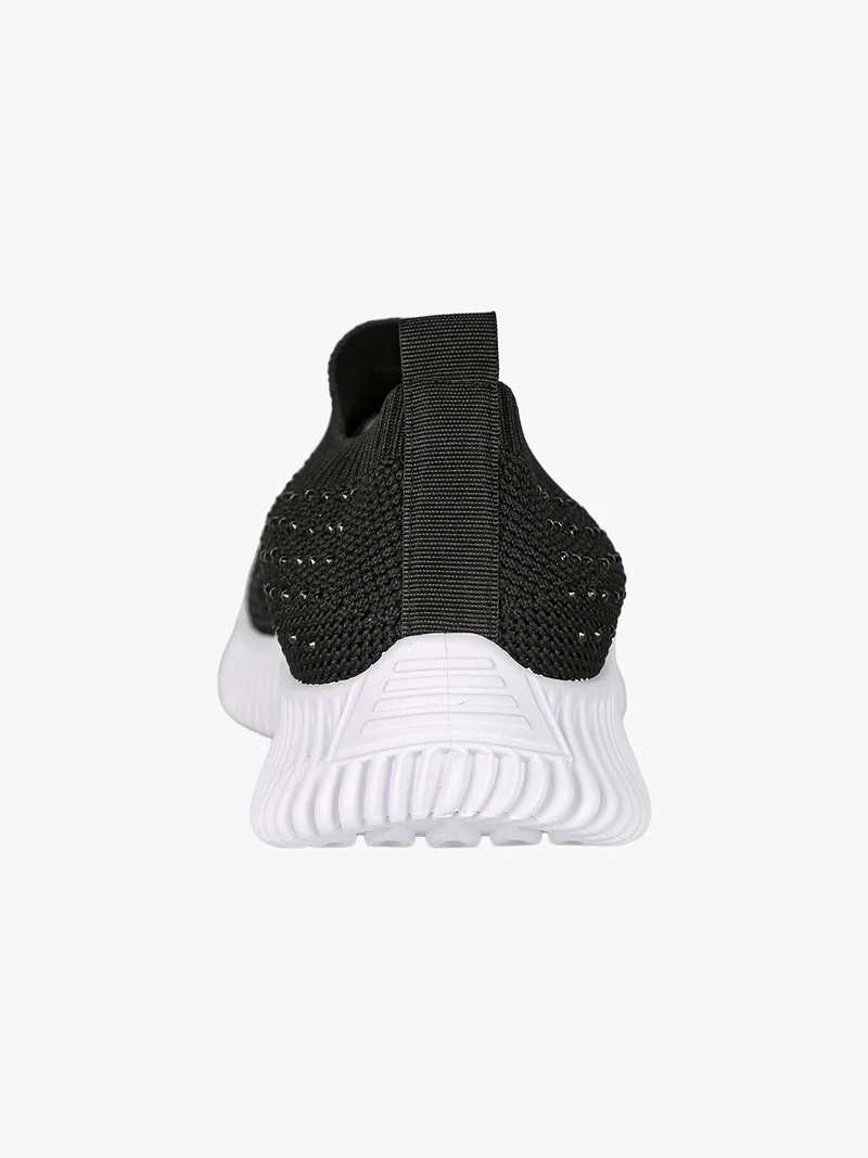 Sneakers donna slip on con borchie - nero