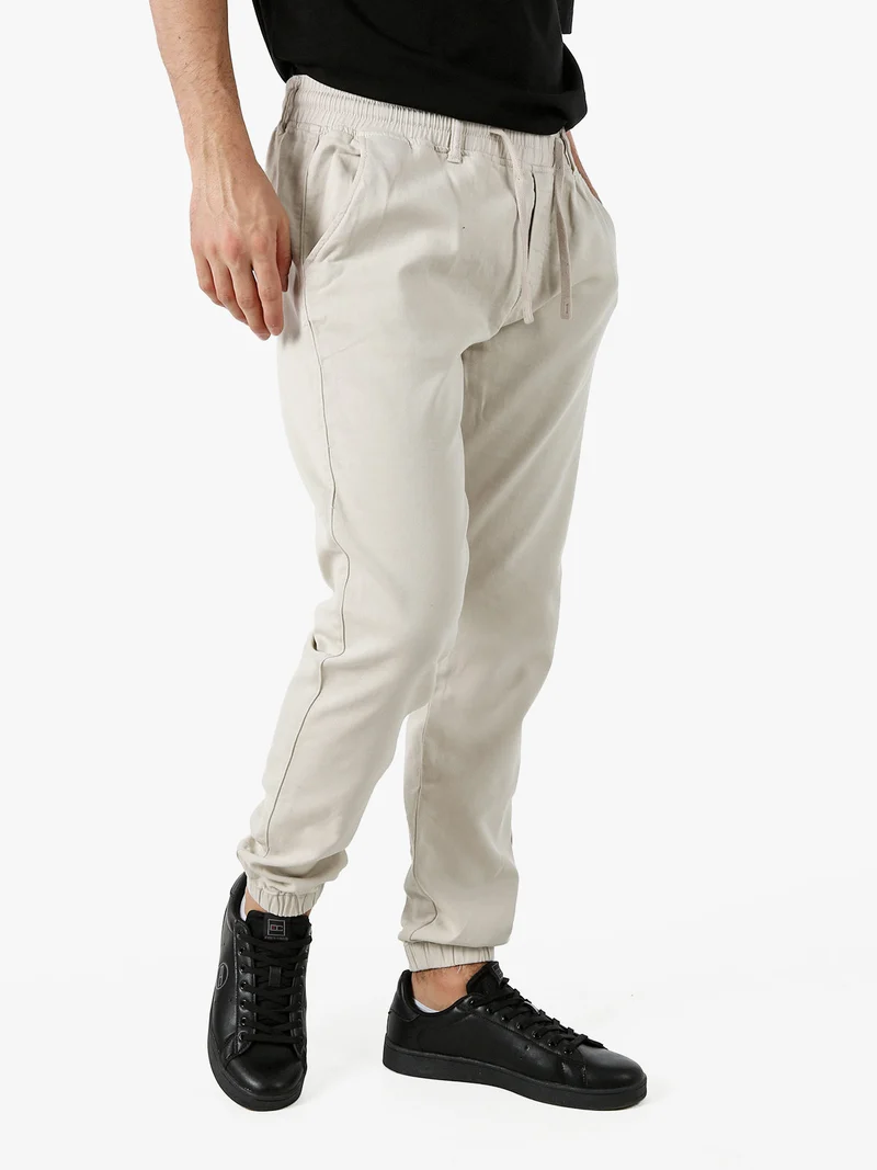 Pantaloni da uomo in cotone con coulisse ed elastico sul finale - beige