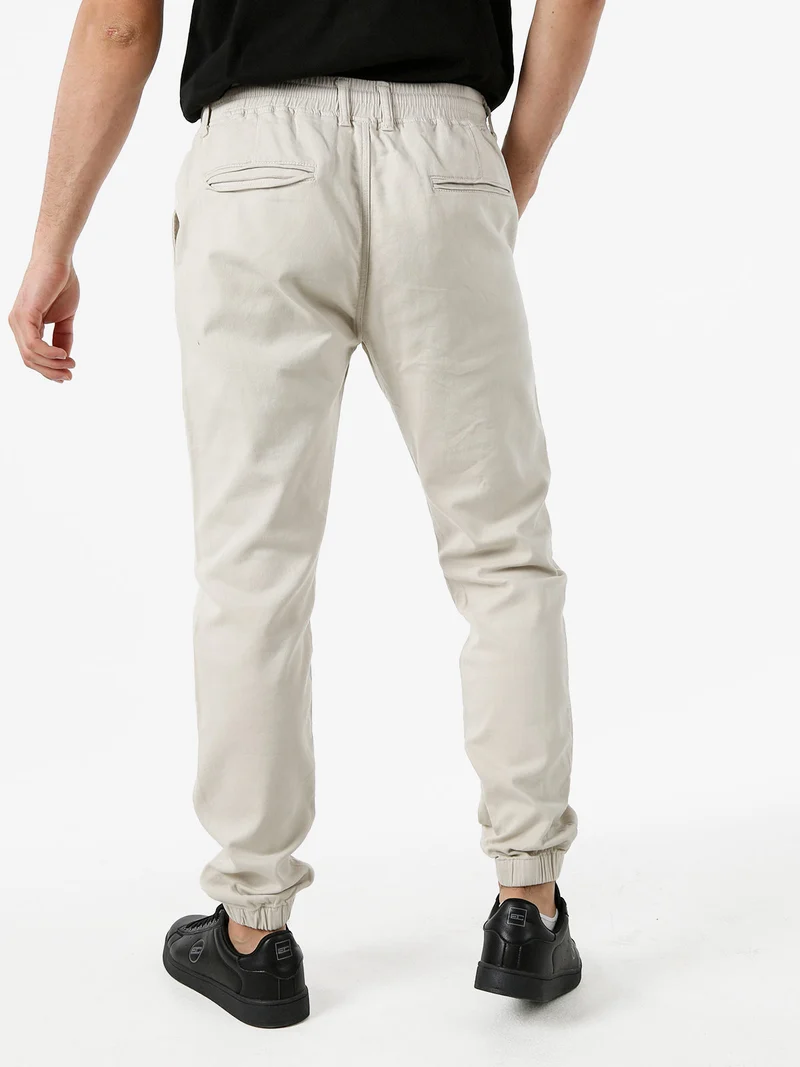 Pantaloni da uomo in cotone con coulisse ed elastico sul finale - beige
