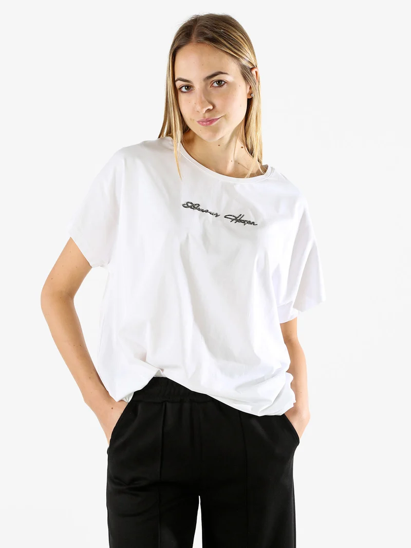 T-shirt donna oversize in cotone con scritta a lustrini - bianco