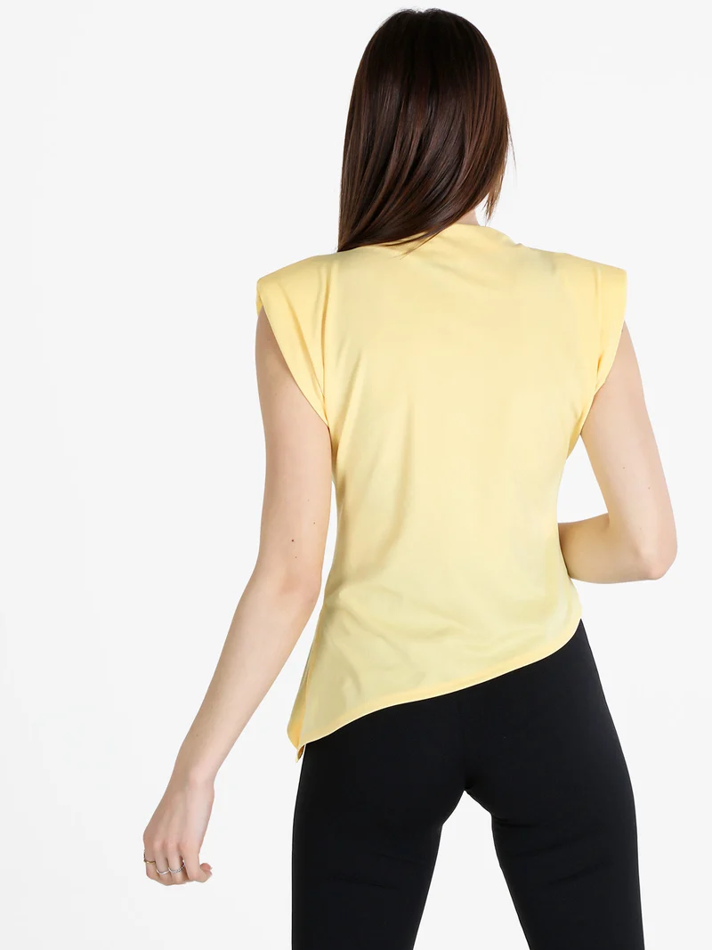 Top donna con spalle imbottite e finale a punta - giallo