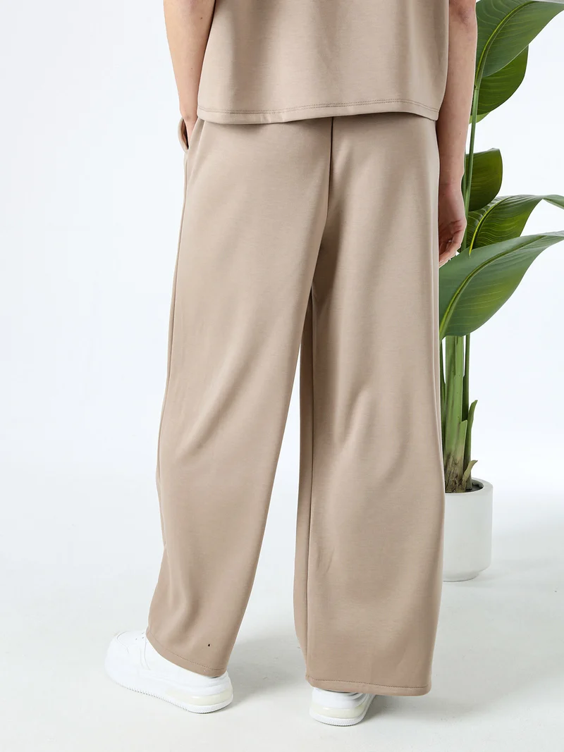 Pantaloni donna in felpa a gamba larga - marrone