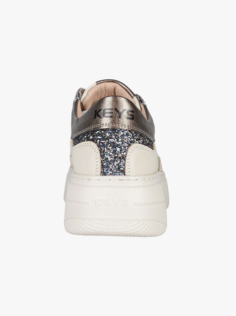 Sneakers donna in pelle con borchie e platform - beige