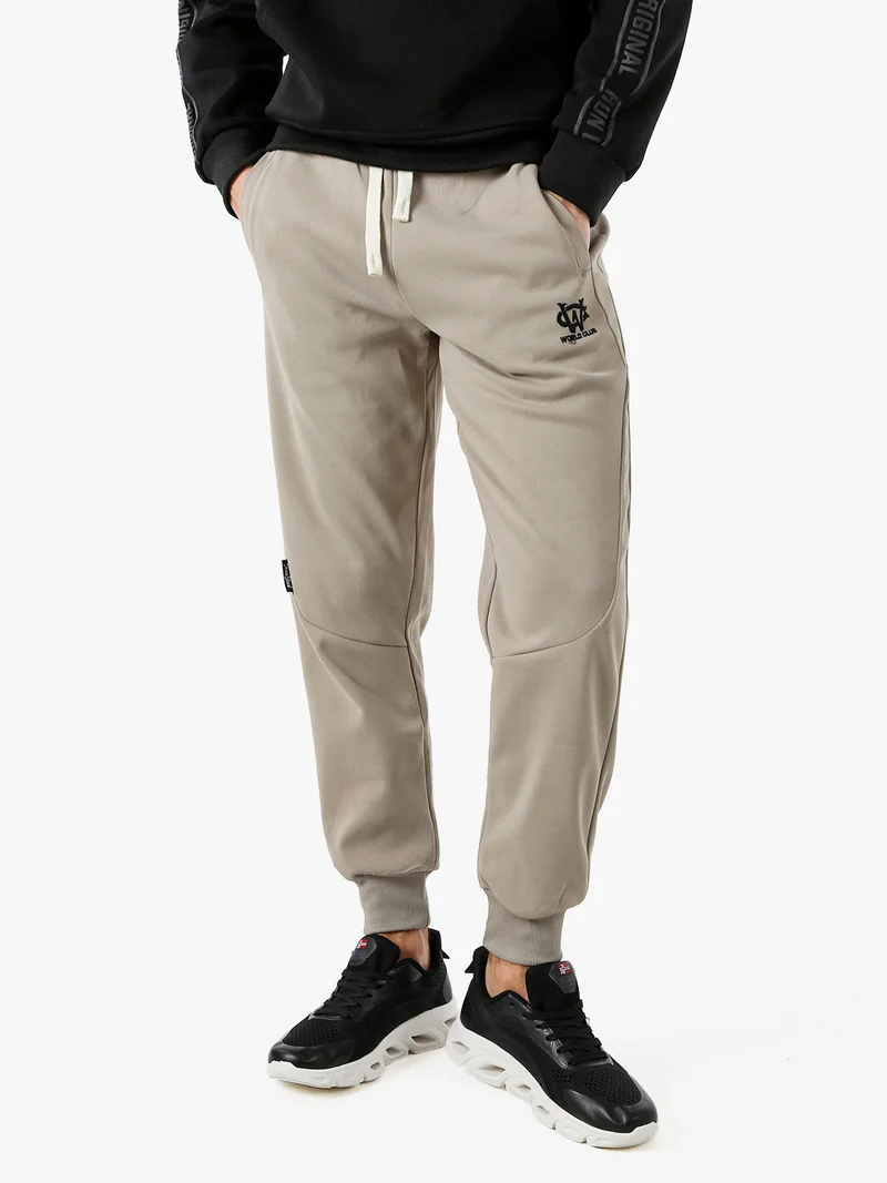 Pantaloni sportivi da uomo con coulisse e polsini - fango