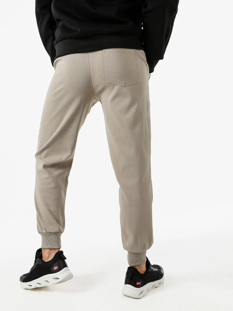 Pantaloni sportivi da uomo con coulisse e polsini - fango