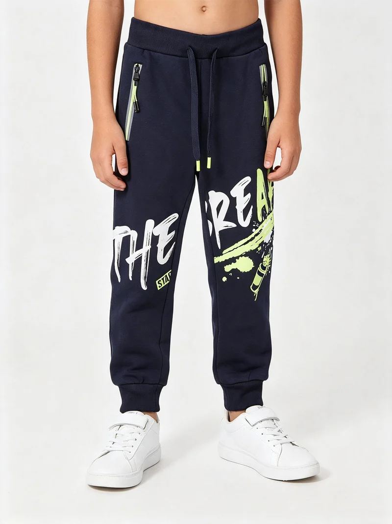 Pantaloni sportivi da bambino con polsini e coulisse - blu